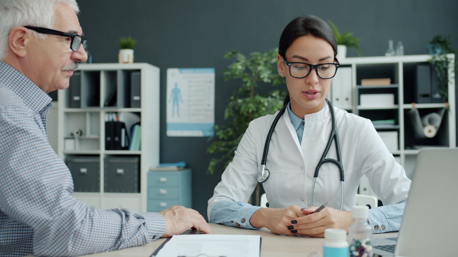 Healthcare professional consulting with a patient in a care setting